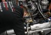 A student from the National Motorsport Academy working on a racecar